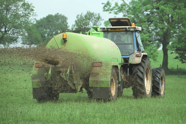 Agricultural slurry spreading in a field in England, United Kingdom stock photo
