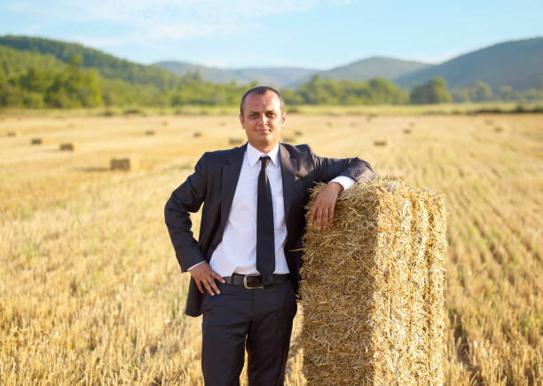 agricultural support Businessman standing in a field symbolizing agricultural support türkiye country photos stock pictures, royalty-free photos & images