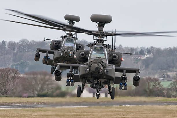 AgustaWestland Apache's AH Mk1 A pair of AAC AgustaWestland Apache's posing for the camera. military helicopter stock pictures, royalty-free photos & images
