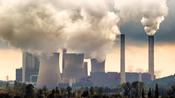Air pollution Brown coal power plant emission. smog stock pictures, royalty-free photos & images