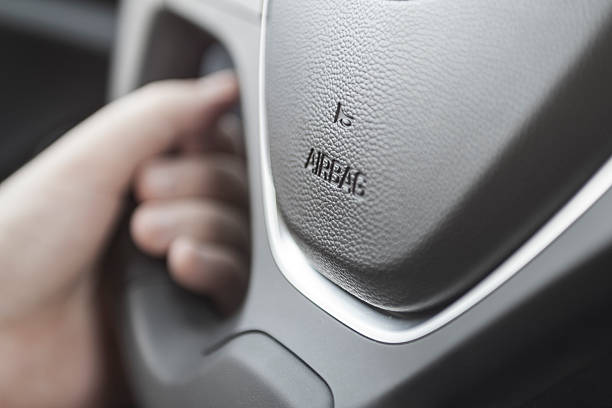 airbag icon on steering wheel stock photo
