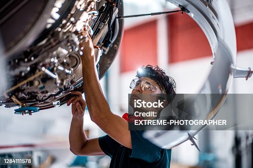 istock Aircraft Mechanic checking jet engine of the airplane 1284111578