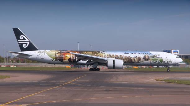 Aircraft LONDON, UK - APRIL 16, 2014: Air New Zealand Boeing 777 with Hobbit movie livery after landing at London Heathrow airport. Air New Zealand carried 13.4 million passengers in 2013. air new zealand stock pictures, royalty-free photos & images