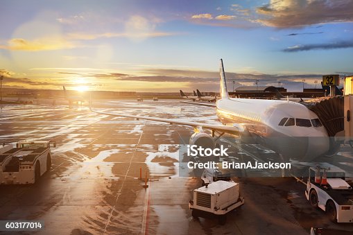 istock Airplane at terminal gate in international airport 603177014