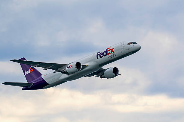 Airplane FedEx jet flying at air show stock photo