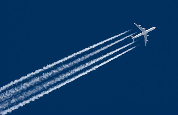 Airplane Leaving Contrail stock photo