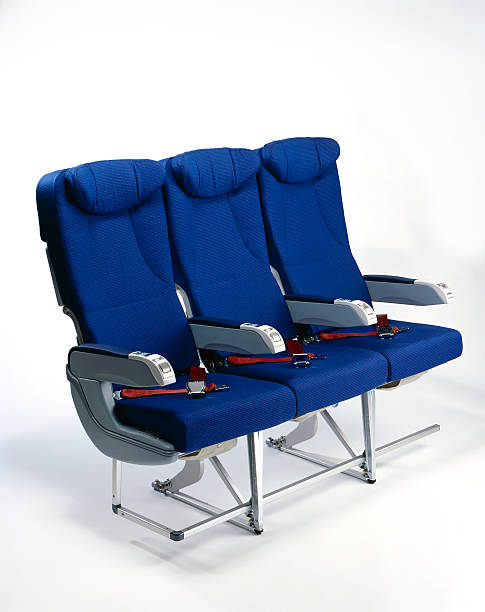 airplane seats three blue airplane seats on white background airplane seat stock pictures, royalty-free photos & images