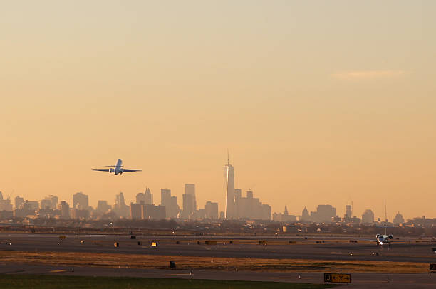 Airplane Take Off with New York City Skyline stock photo