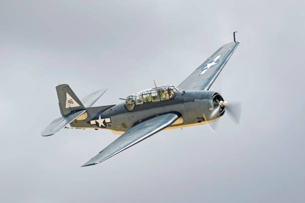 Airplane TBM Avemger WWII bomber aircraft flying at the airshow Chino, California,USA - May 7,2017. TBM Avenger WWII war bird flying at the 2017 Planes of Fame Airshow in Chino, California. The 2017 Planes of Fame Airshow features vintage WWII war birds and various jet aircraft including the modern F-35 Lightning stealth fighter flying for the general public. ww2 american fighter planes stock pictures, royalty-free photos & images