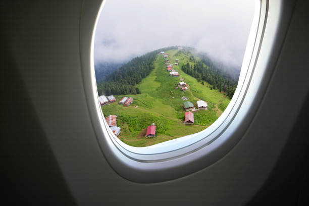 Airplane window and Pokut Highland in Rize Province, Blacksea part of Turkey. Airplane window and Pokut Highland in Rize Province, Blacksea part of Turkey. plane window seat stock pictures, royalty-free photos & images