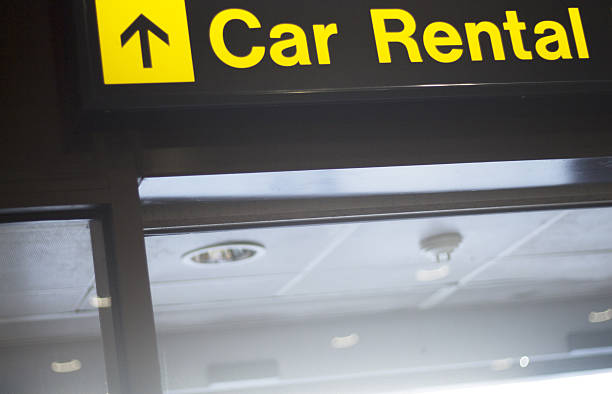 Airport information car rental sign Airport information car rental sign light panel giving directions in departure lounge. car rental stock pictures, royalty-free photos & images