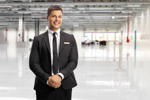 Airport official in a suit and tie posing stock photo