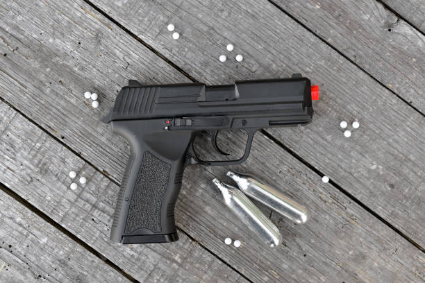 airsoft-gun-with-gas-canisters-and-shots-picture-id1269300683?k=20&m=1269300683&s=612x612&w=0&h=2gAI9_UOUqRvji0Qni2pbhb4z2SB8fGr8Jn6aqr_9XM=