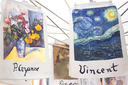 Aix-en-Provence, France: A retail display of Cezanne and Van Gogh dish towels for sale at the outdoor market on Cours Mirabeau in Aix-en-Provence. Both artists lived in Provence.