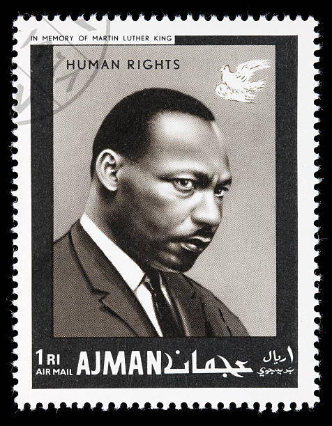 Ajman Martin Luther King postage stamp Sacramento, California, USA - December 25, 2008: A 1968 Ajman postage stamp with a portrait of Martin Luther King, Jr. The stamp is part of the "human rights" series issued in memory of MLK. martin luther king stock pictures, royalty-free photos & images