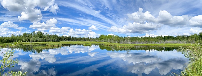 The beauty of Interior Alaska is enhanced with the smooth reflective waters.
