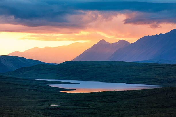 Alaska Range lake sunet stock photo