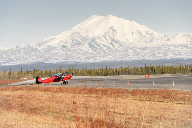 Alaska Remote Airport in Spring With Bush Plane and Mountain stock photo