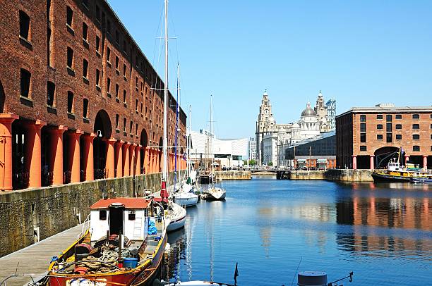Albert Dock, Liverpool. Liverpool, United Kingdom - June 11, 2015: Yachts moored in Albert Dock with the Three Graces to the rear and tourists enjoying the sights, Liverpool, Merseyside, England, UK, Western Europe. cunard building liverpool stock pictures, royalty-free photos & images
