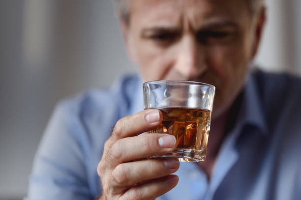 Alcohol addiction Man drinking whiskey. Alcohol addiction concept. alcohol abuse stock pictures, royalty-free photos & images
