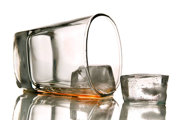 alcoholism tipped over glass of alcoholic drink. View more drinks alcohol abuse stock pictures, royalty-free photos & images