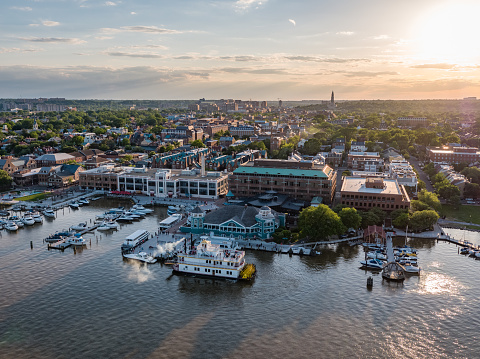 Aerial view of the waterfront at Old Town Alexandria, Virginia at sunset, featuring the Cherry Blossom paddlewheel boat