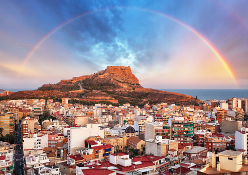 Alicante In Spain At Sunset With Rainbow Stock Photo - Download Image