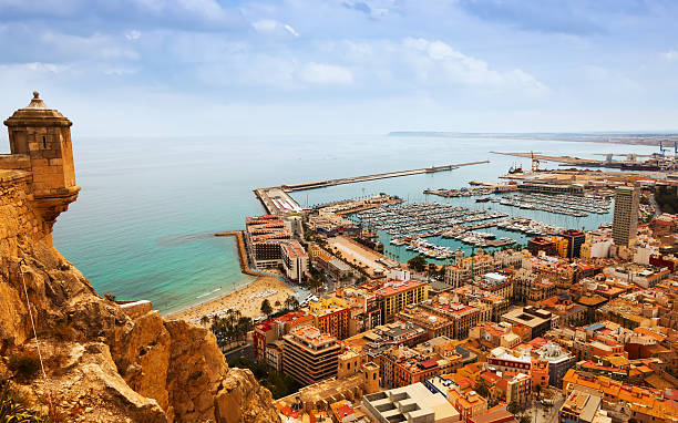 Alicante with docked yachts from castle. Spain Top view of Port  in Alicante with docked yachts from castle. Spain alicante province stock pictures, royalty-free photos & images