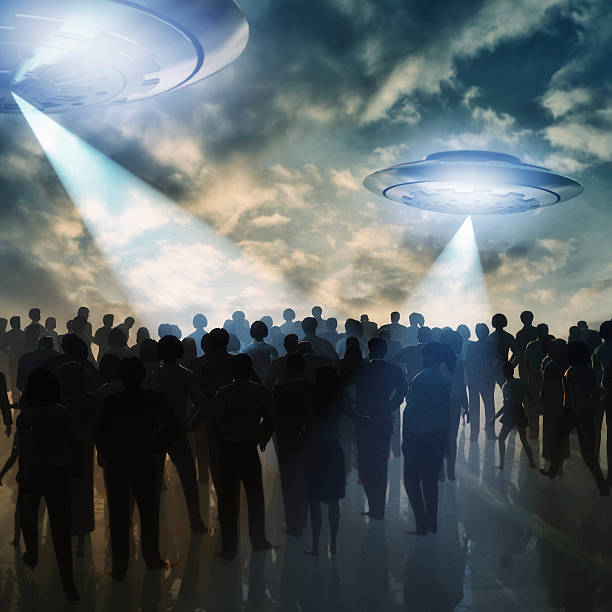 alien ufos invading earth - beach game group stockfoto's en -beelden