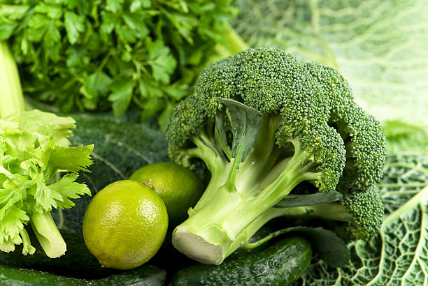 allsorts of green vegetables stock photo