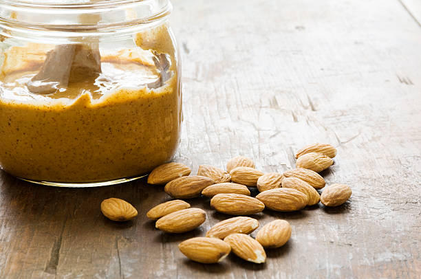 Almond Butter Jar of homemade almond butter. almond butter stock pictures, royalty-free photos & images