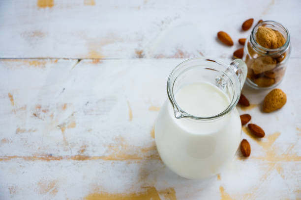 Almond milk in jug stock photo