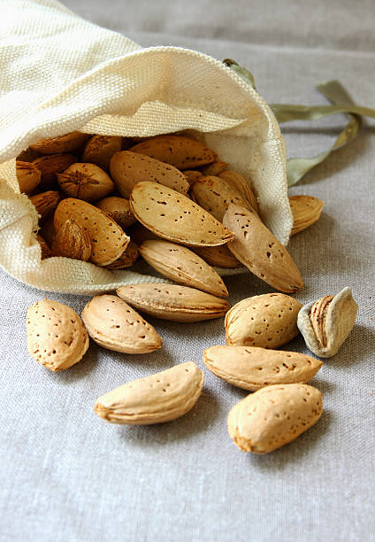 Almonds, lying in a small pouch.. stock photo