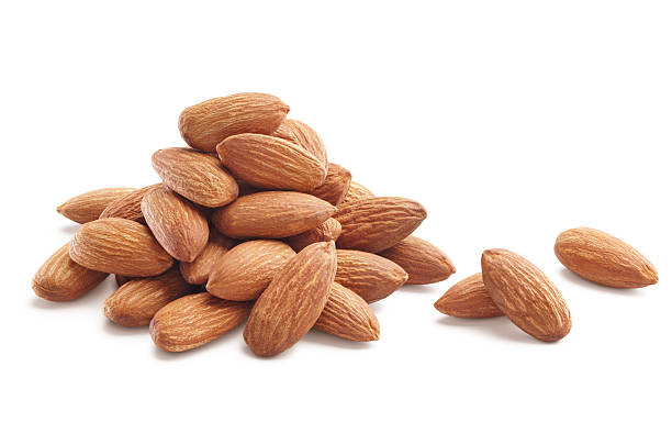 almonds heap of almonds isolated on white background almond photos stock pictures, royalty-free photos & images