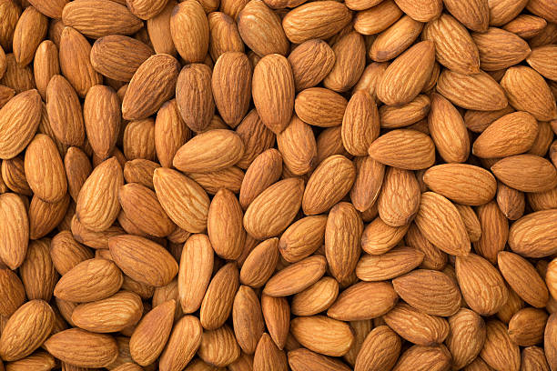 Almonds Almonds background almond photos stock pictures, royalty-free photos & images