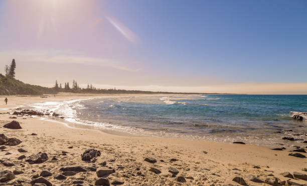 Almost deserted beach on a bright sunny day in Australia stock photo