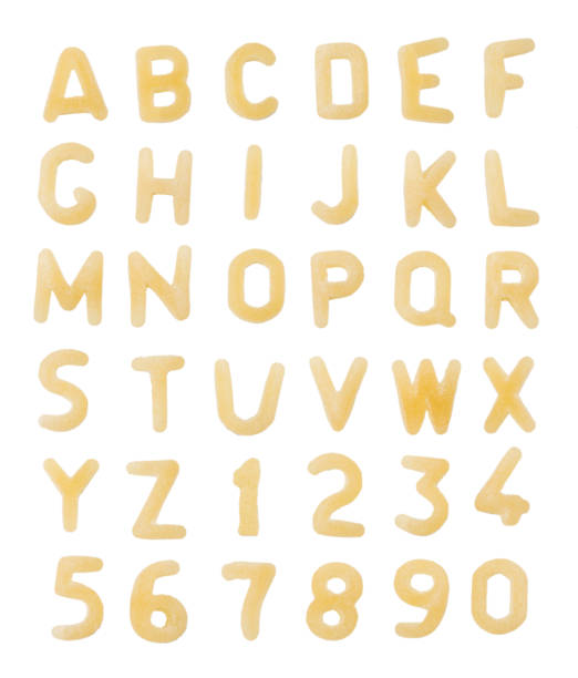 Alphabet made of macaroni letters isolated on white background stock photo