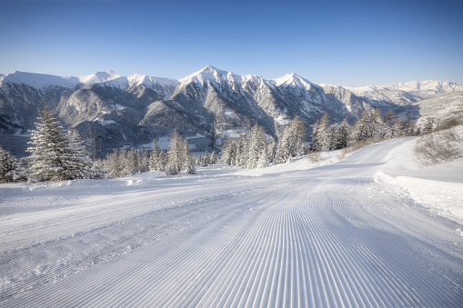 Freshly groomed slope in the Alps.