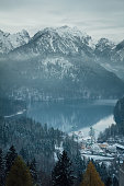 Alpsee lake landscape with Alps mountains near Munich in Bavaria, Germany. Winter time