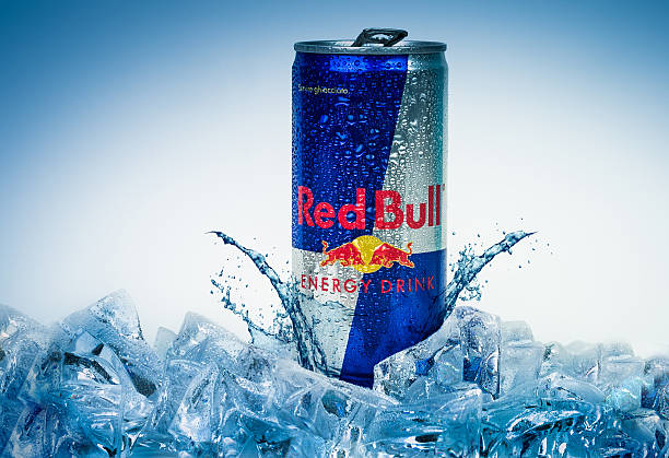 Aluminium can of Red Bull Energy drink iced Background stock photo