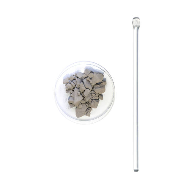 Aluminium powder in Chemical Watch Glass placed next to stirring rod. Closeup chemical ingredient on white laboratory table. Top View stock photo