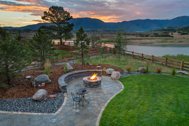 Amazing Backyard with Fire Pit Amazing Backyard with Fire Pit landscaped stock pictures, royalty-free photos & images
