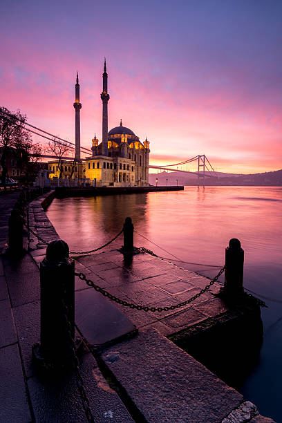 amazing sunrise at ortakoy mosque, istanbul - galata stockfoto's en -beelden