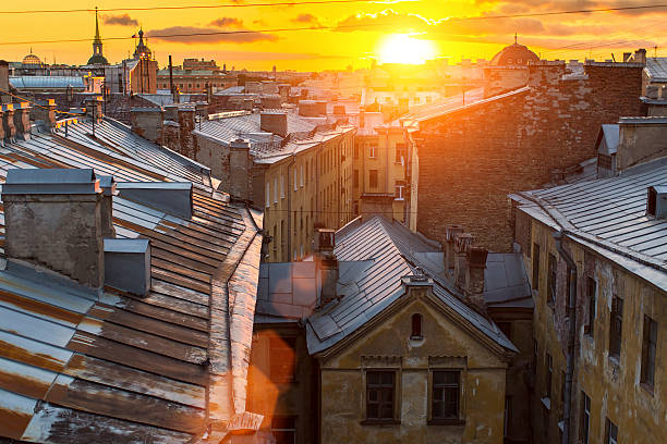 Amazing sunset on the roofs of the old district stock photo