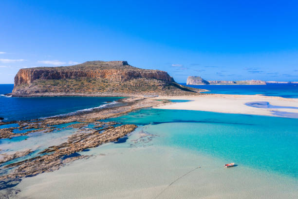 Amazing view of Balos Lagoon with magical turquoise waters, lagoons, tropical beaches of pure white sand and Gramvousa island on Crete, Greece stock photo