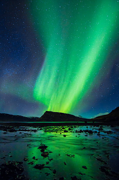 Amazingly reflected celestial lights Aurora Borealis above Iceland's winter sky stock photo