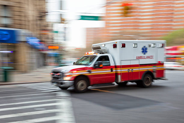 Ambulance Speeding in New York, Blurred Motion ambulance speeding in New York City, blurred motion, horizontal orientation, USA 911 new york stock pictures, royalty-free photos & images