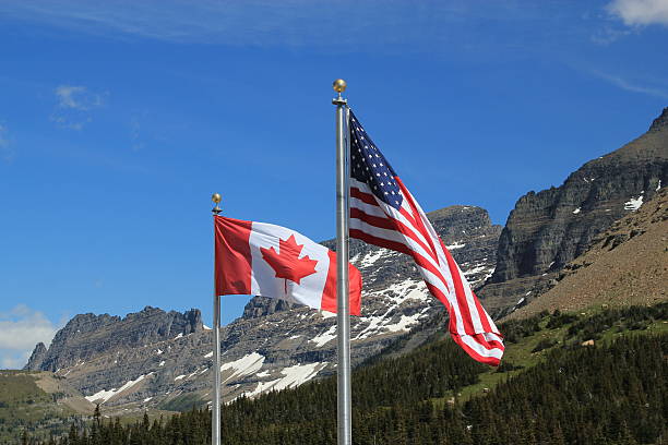 American and Canadian flags stock photo