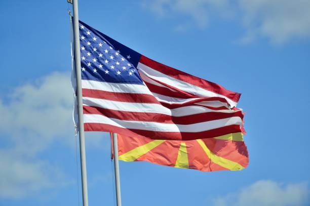 American and Macedonian flags. Language learning, international business or travel concept. stock photo