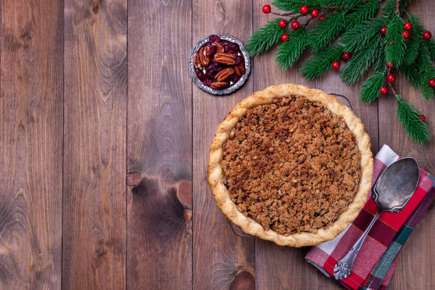 American apple cranberry pie, topped with crumbled dough and pecan, horizontal, top stock photo